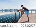 Young Asian Man Stretching Before Exercise 9230257