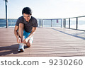 Young Asian Man Tying Running Shoelaces 9230260
