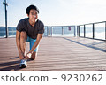 Young Asian Man Tying Running Shoelaces 9230262