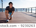 Young Asian Man Tying Running Shoelaces 9230263