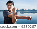 Young Asian Man Warming Up Before A Run 9230267