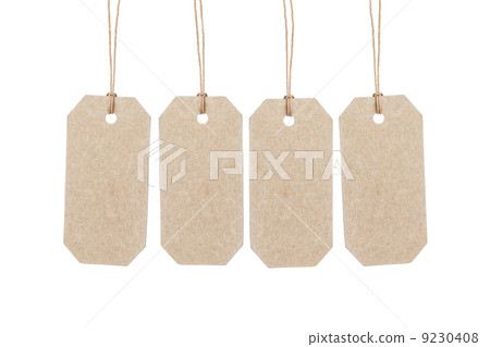 four brown tags hanging on ropes four brown tags hanging on ropes 9230408