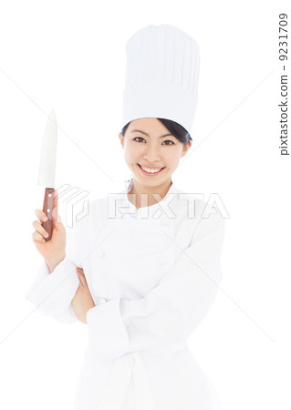 A woman with a kitchen knife 9231709