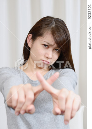 A young woman giving out x 9232801