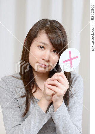 A young woman giving out x 9232805