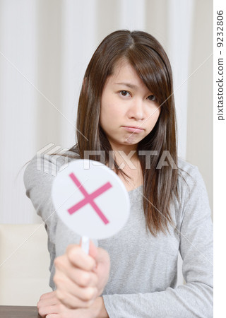 A young woman giving out x 9232806