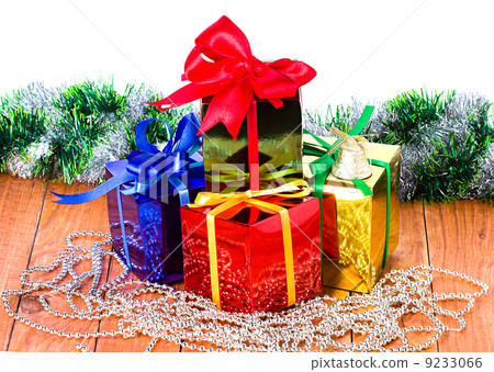 Christmas presents on a wooden background 9233066