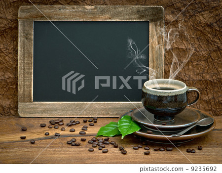 cup of coffee and vintage style blackboard 9235692