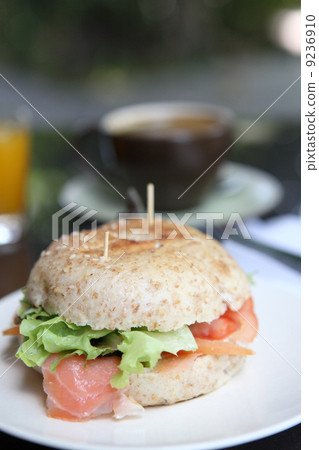 fresh bagel with salmon orange juice and coffee 9236910
