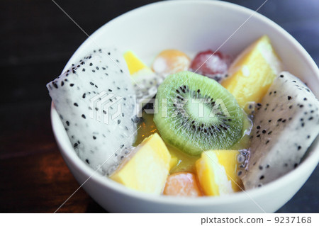 fruit salad on wood background fruit salad on wood background 9237168