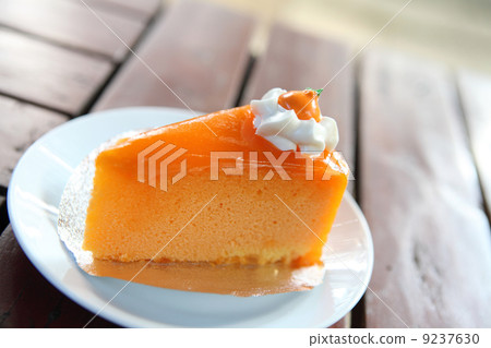 Orange cake on wood background 9237630