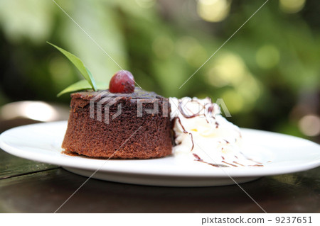 chocolate cake on wood background chocolate cake on wood background 9237651