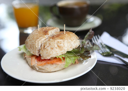 fresh bagel with salmon orange juice and coffee 9238020