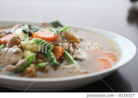 Thai food Wide Noodles in a Creamy Sauce with pork 9238357