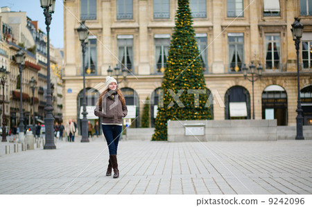 Girl on a Parisian street decorated for Christmas Girl on a Parisian street decorated for Christmas 9242096