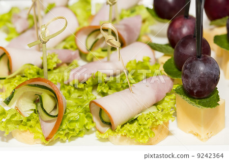 canape with meat vegetables and seafood 9242364