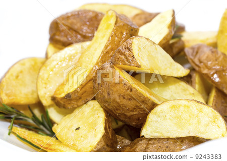 baked potatoes on a white background in restaurant 9243383