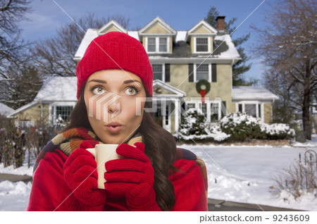 Woman in Winter Clothing Holding Mug Outside in Snow Woman in Winter Clothing Holding Mug Outside in Snow 9243609