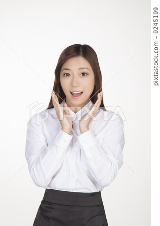 Business woman with mouth open, hands at side of cheeks and away from face 9245199