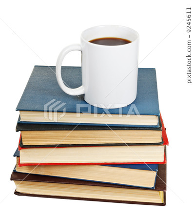 white cup of coffee on stack of books 9245611