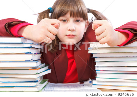 schoolgirl, schoolwork and stack of books schoolgirl, schoolwork and stack of books 9245656