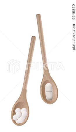 Tablets in a wooden spoones Tablets in a wooden spoones 9246880