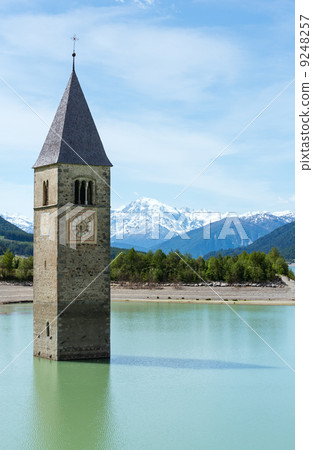 The bell tower in Reschensee (Italy). 9248257