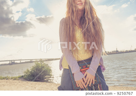 blonde girl against sky, sea and coast. blonde girl against sky, sea and coast. 9250767