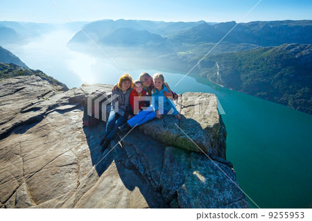 Happy family on  Preikestolen massive cliff top (Norway) 9255953