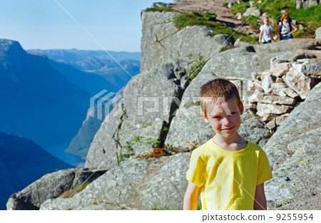 Family on  Preikestolen massive cliff top (Norway) 9255954