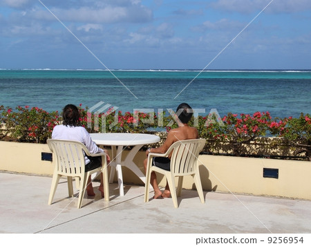 An old couple looking at Achao Beach 9256954