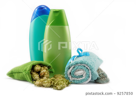 Spa or bathroom concept with towels, soaps and hops on a white b Spa or bathroom concept with towels, soaps and hops on a white b 9257850