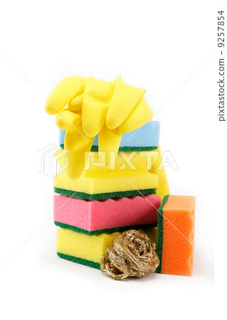 Rubber gloves and a cleaning sponges on a white background. Rubber gloves and a cleaning sponges on a white background. 9257854