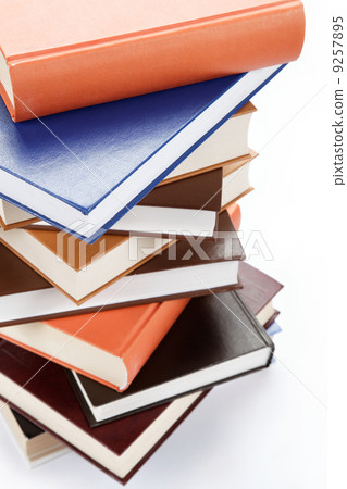 A stack of books on a white background. A stack of books on a white background. 9257895