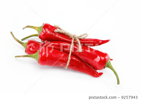 Red hot chili peppers tied with rope isolated on white 9257943
