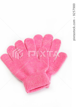 Pink woolen gloves, isolated on white background. Cold winter cl 9257980