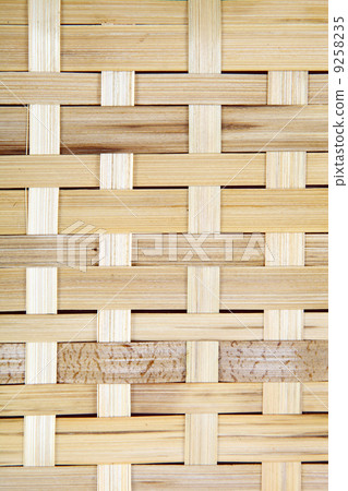 Wooden grid, the background of woven wood. Bamboo wood texture. 9258235