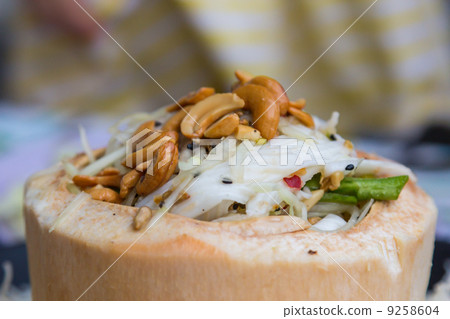 Green papaya salad decorate in coconut style 9258604
