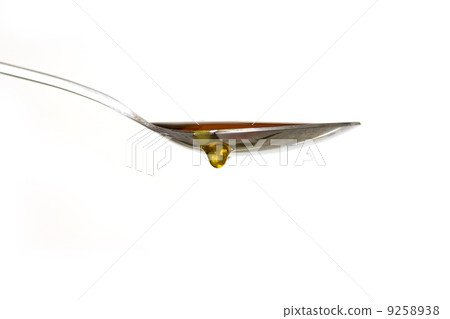 Honey drop from spoon 9258938