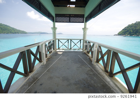 pier on a blue beach 9261941