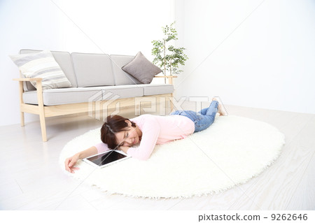 Relaxing women and tablet devices Relaxing women and tablet devices 9262646