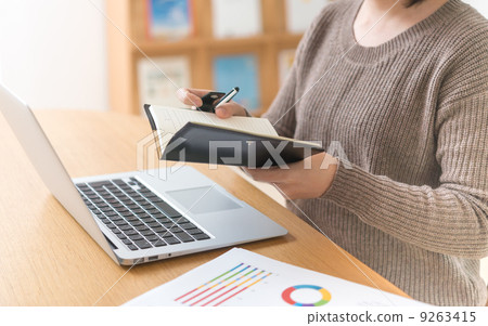 A woman watching a notebook 9263415