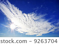 blue sky with sun and clouds 9263704