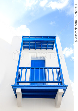 Blue colonial door on a wall Blue colonial door on a wall 9264911