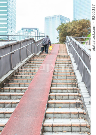 People walking on footbridge in Tokyo, Japan 9265337