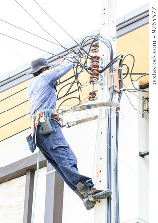 Electrician connect a Power line 9265577