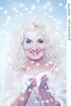 Snow queen playing with snow 9268799