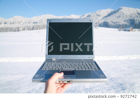 laptop in winter landscape 9272742
