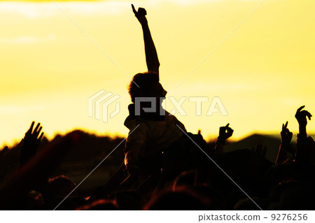 crowdsurfer open-air crowd cheering sunset crowdsurfer open-air crowd cheering sunset 9276256