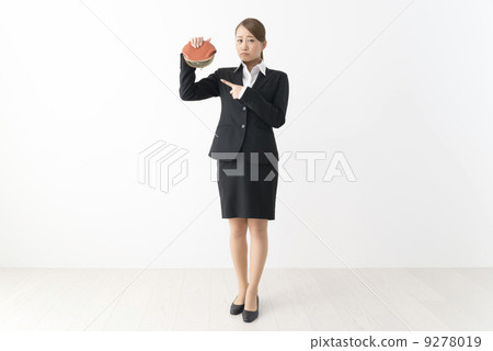 A woman in a suit with a wallet 9278019